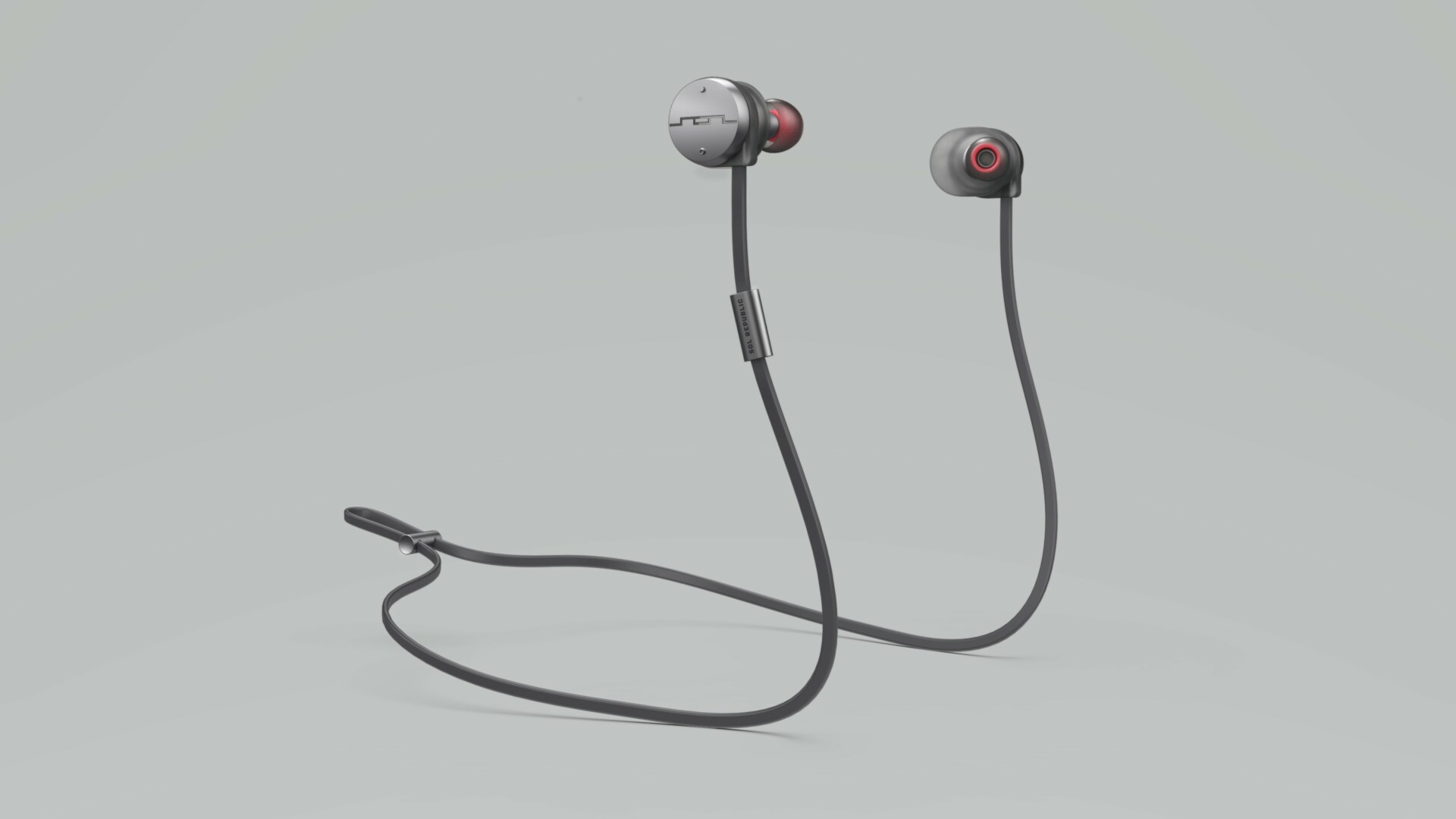 Sol Republic Freestyle wireless earbuds on gray background.