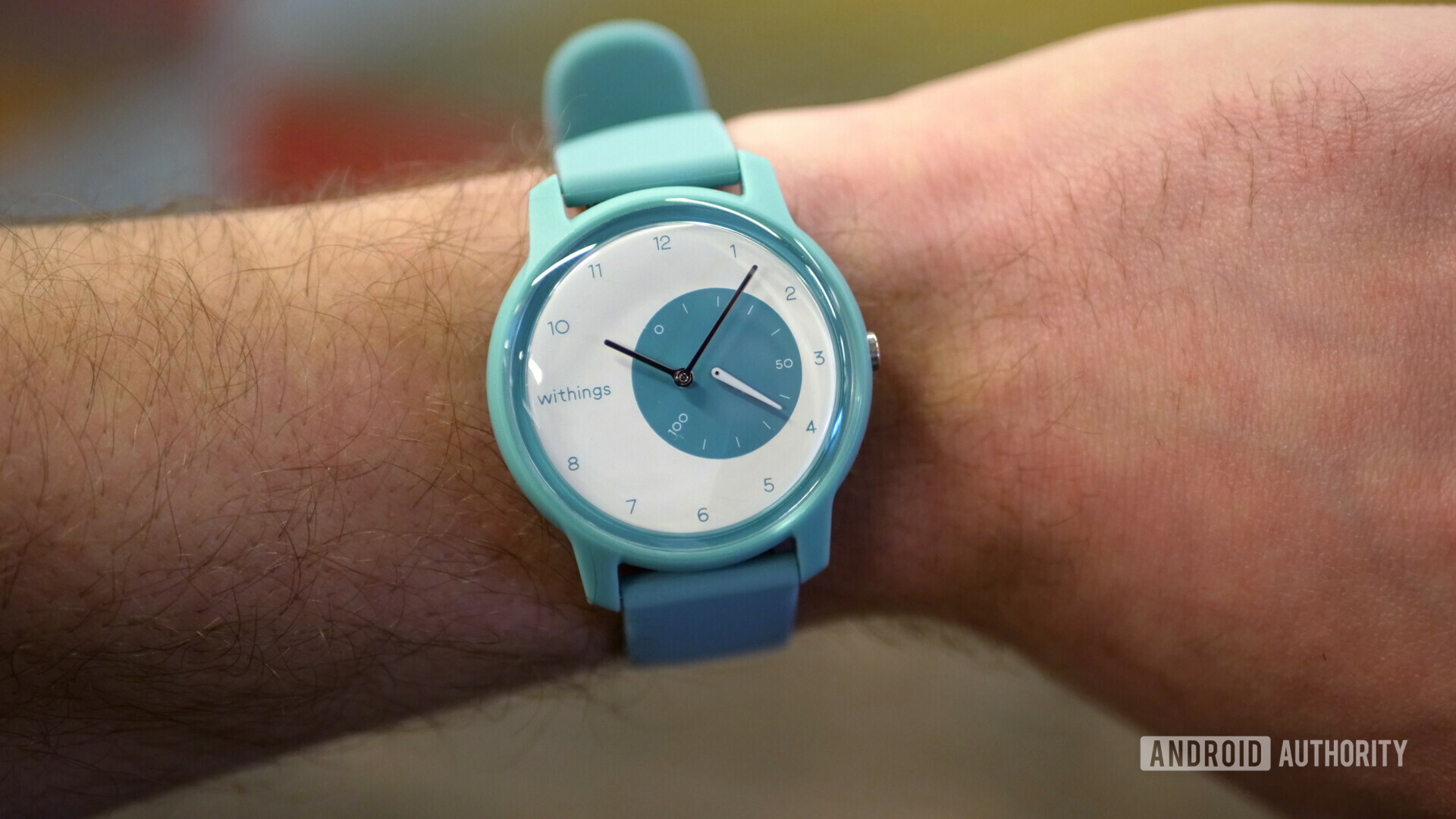 withings move fitness watch light blue on wrist