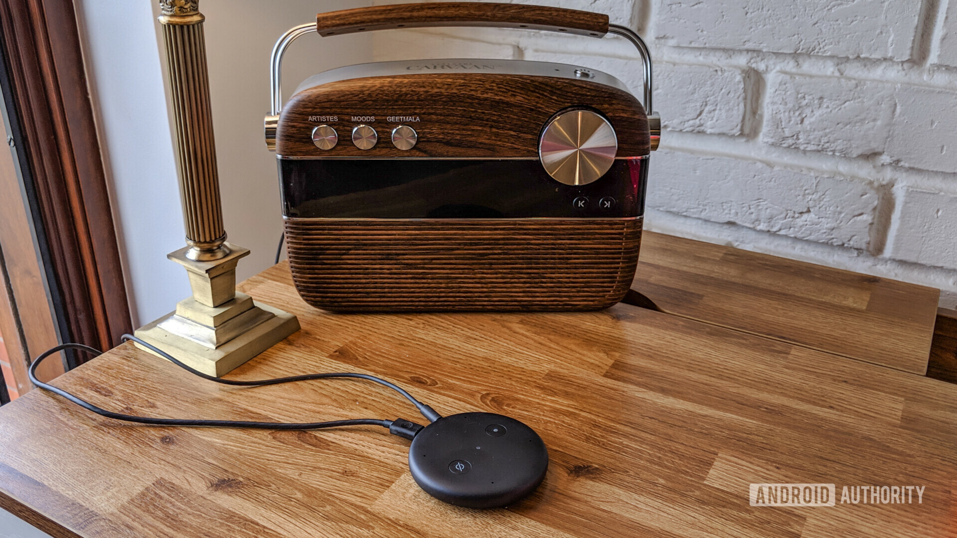 Amazon Echo Input next to a retro radio on a wooden table.