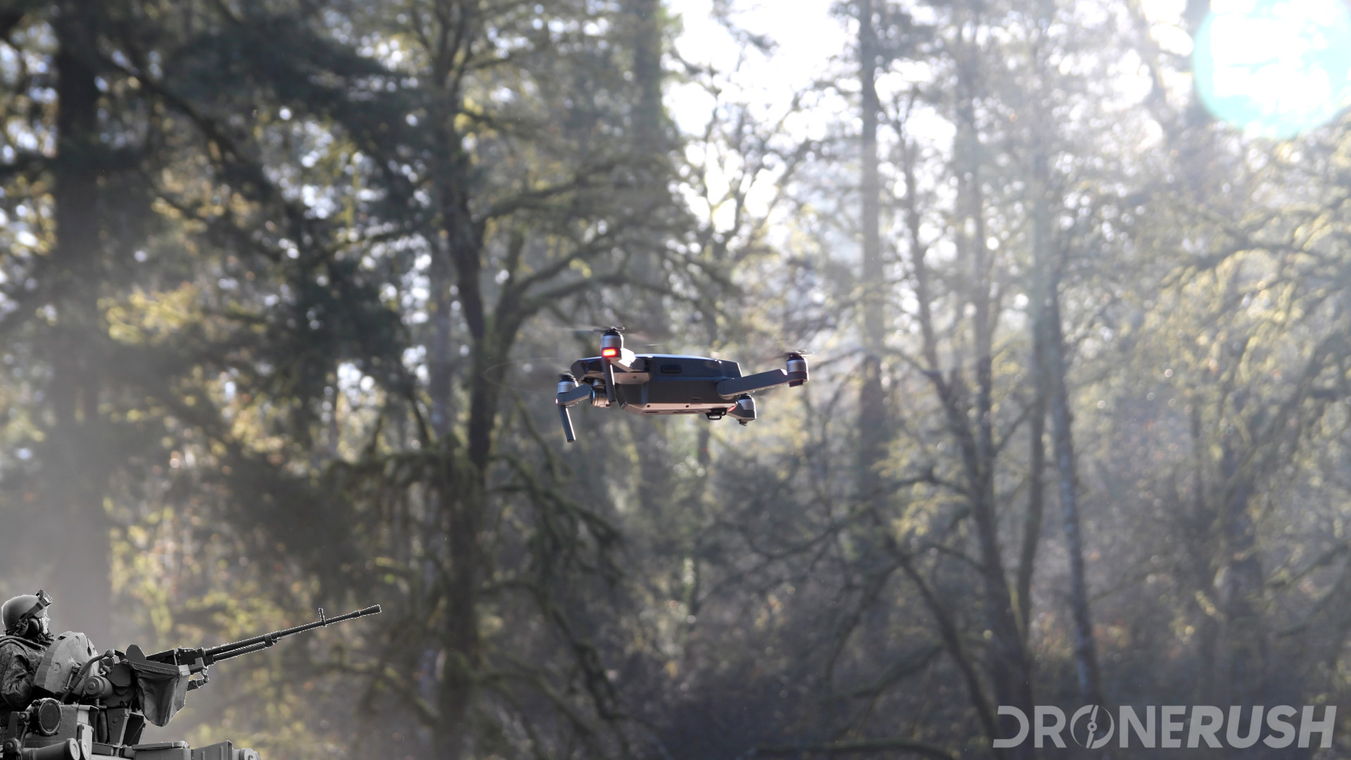 DJI Mavic Pro hovering next to a machine gun - Don't shoot drones, its illegal.