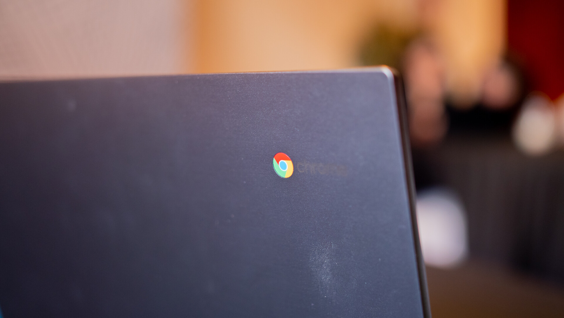 The Chrome logo on the back of a Chromebook. 
