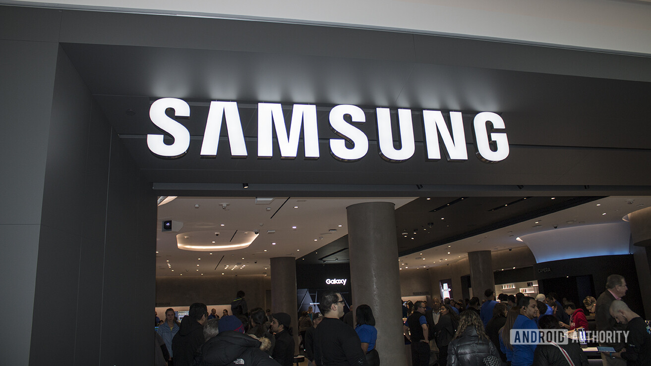 A view of the Samsung Experience Store in Long Island, from the outside looking in. The Samsung logo is above the entry.
