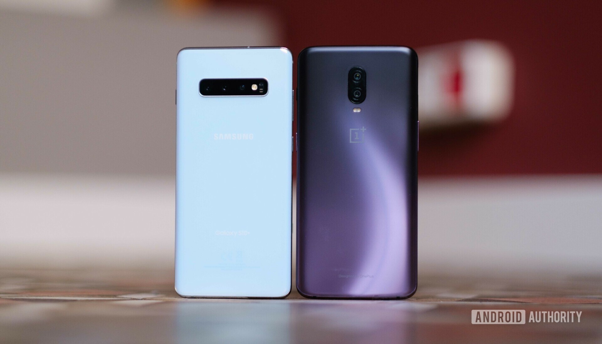 Backside of the Samsung Galaxy S10 Plus next to an OnePlus 6T 
