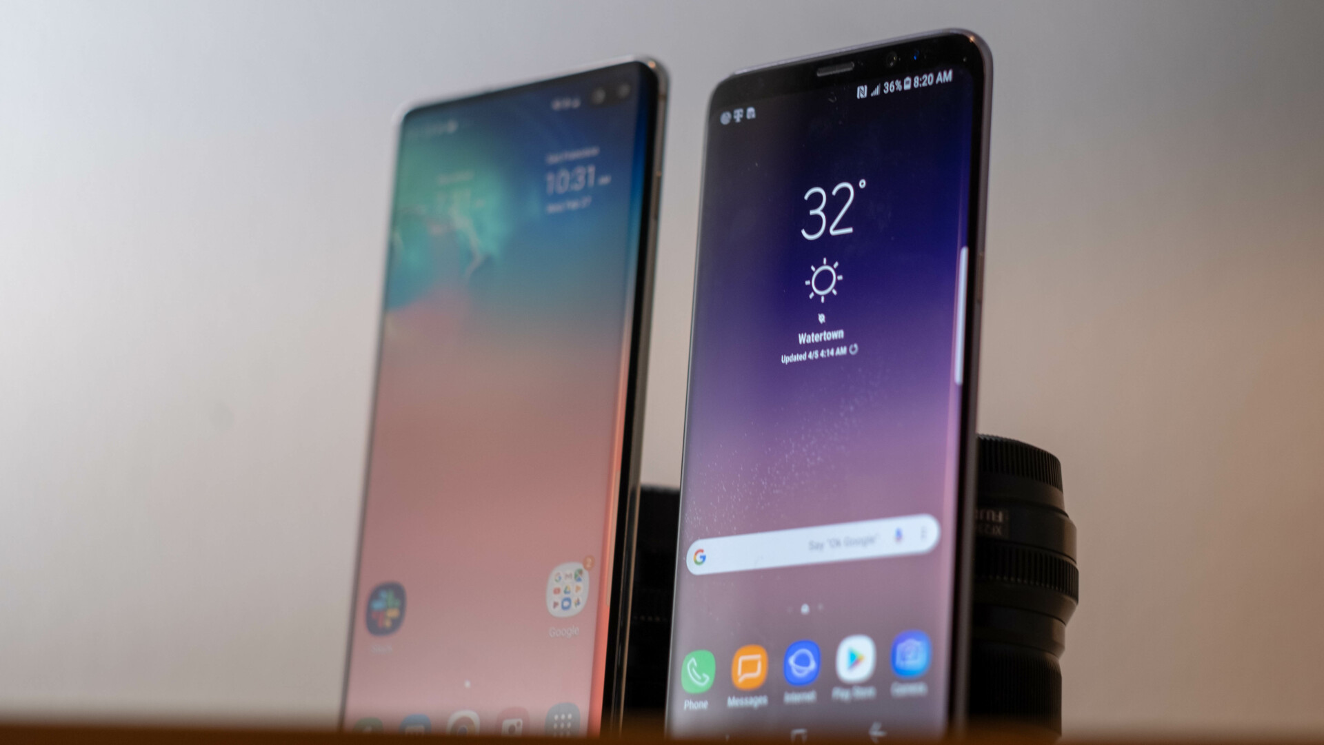 A Samsung Galaxy S10 Plus next to a Samsung Galaxy S8 showing both screens.
