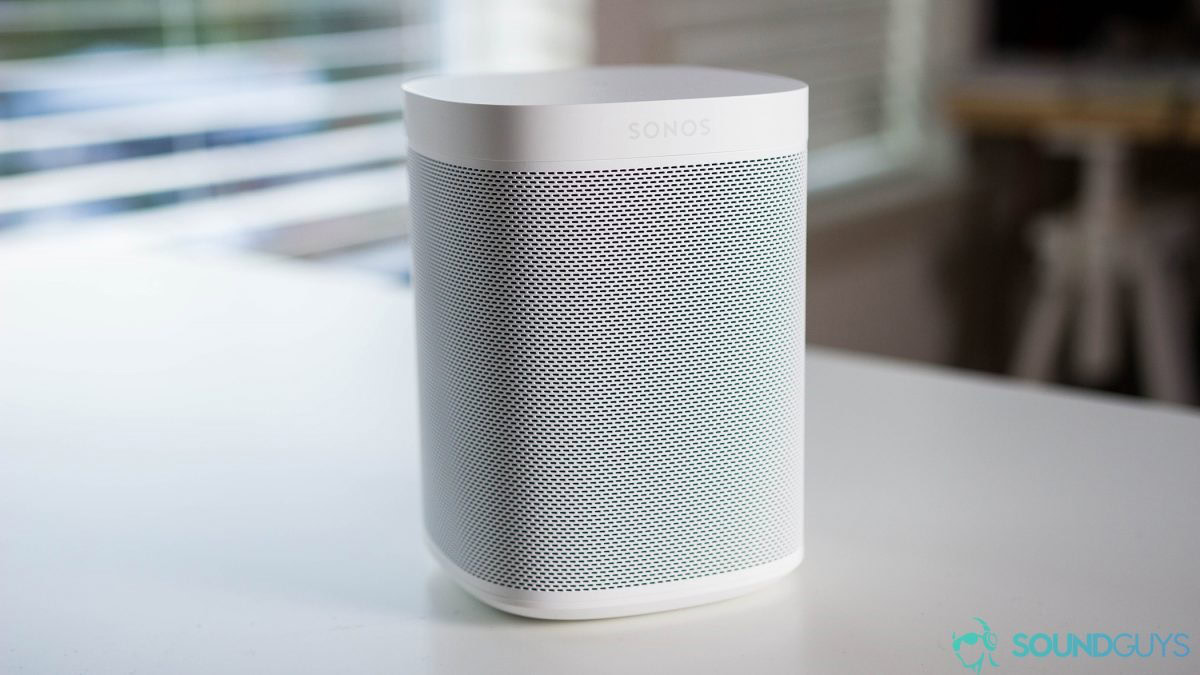 A Sonos One speaker on a table.