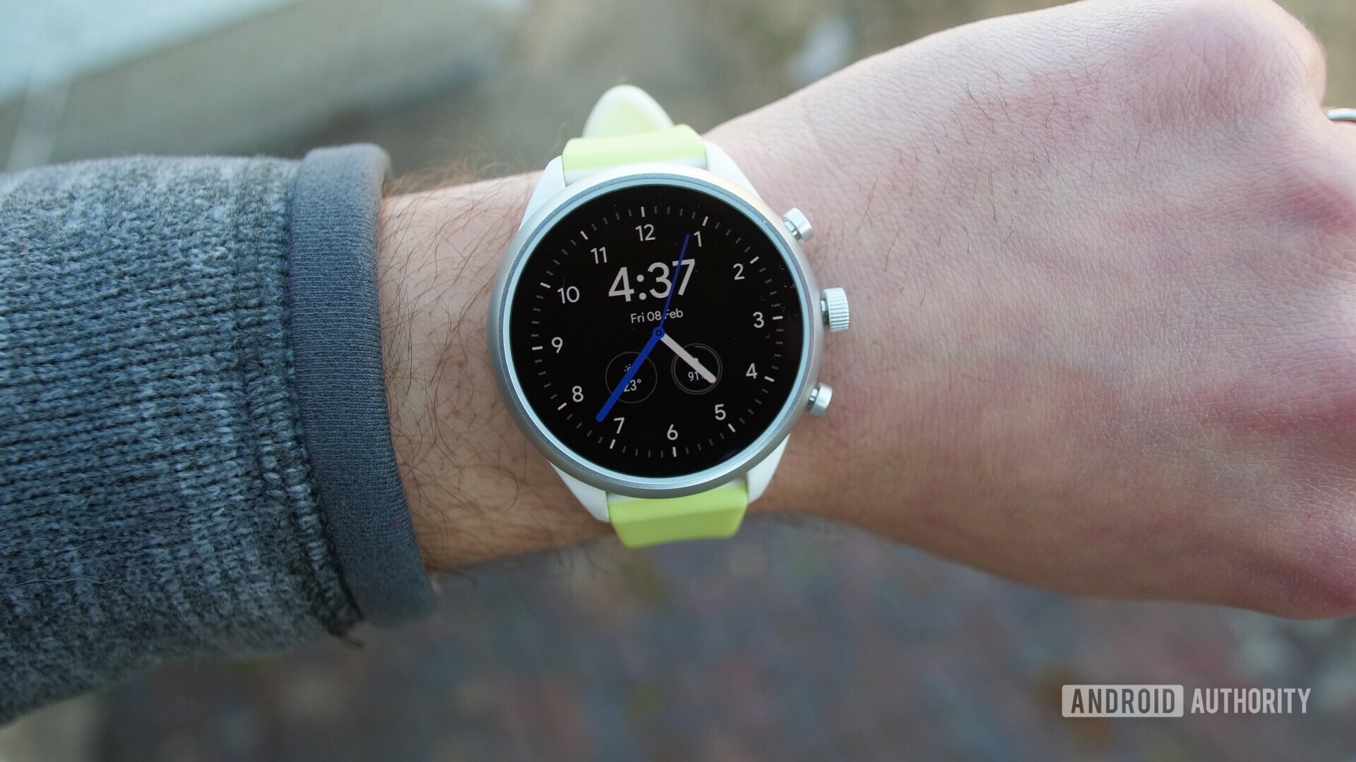 Photo of smartwatch Fossil Sport on a hand with turned on oled display watch face