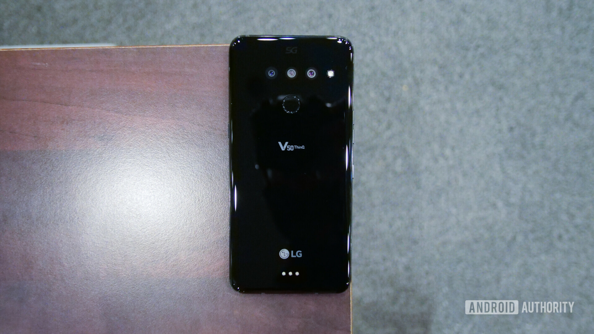 Back side of the LG V50 ThinQ on a table.