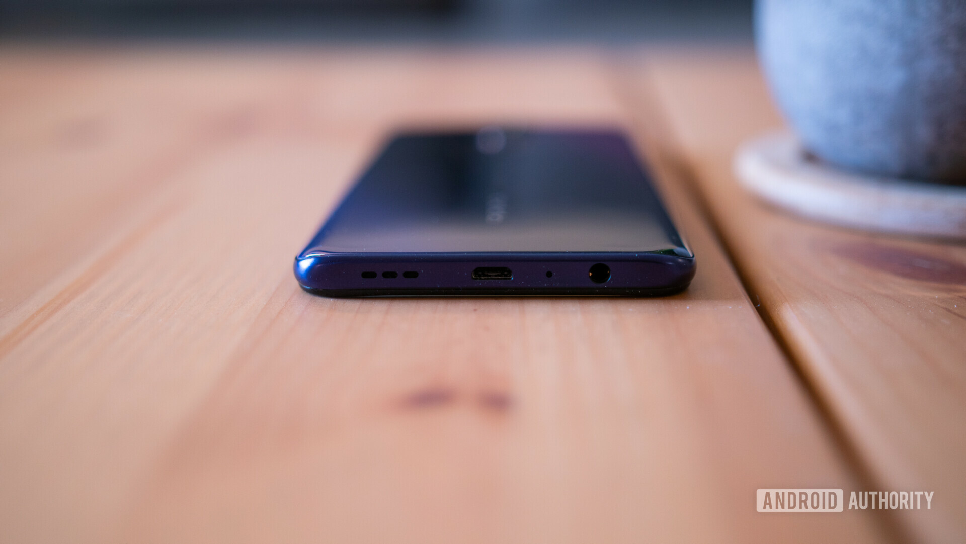 Bottom side view of the OPPO F11 Pro headphone jack, Micro-USB port and speaker grill.