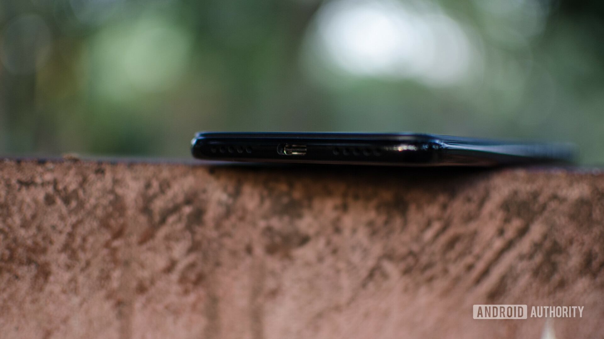 Bottom side of the Redmi Note 7 Pro focusing on the USB Type-C port and speaker grill.