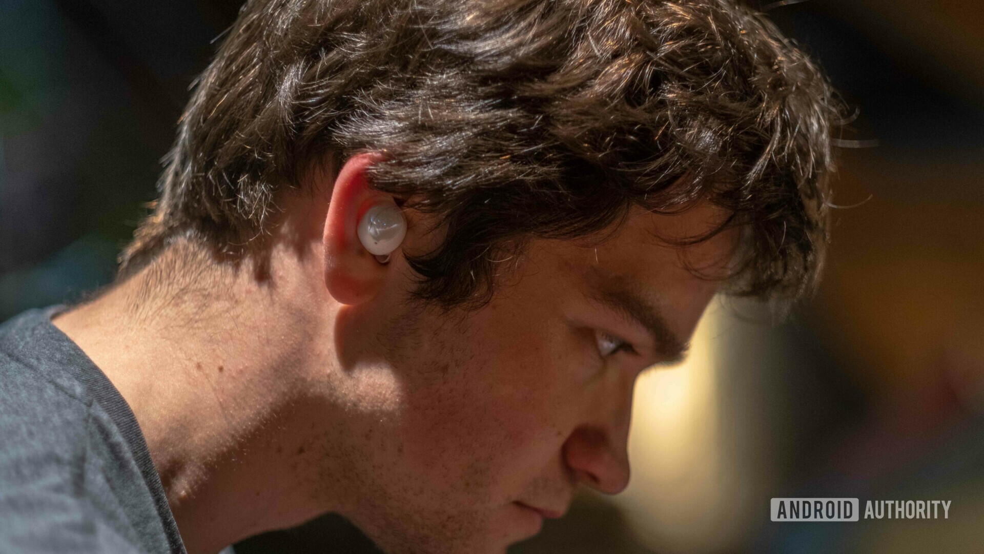 View of the Samsung Galaxy Buds worn in ear by a man.