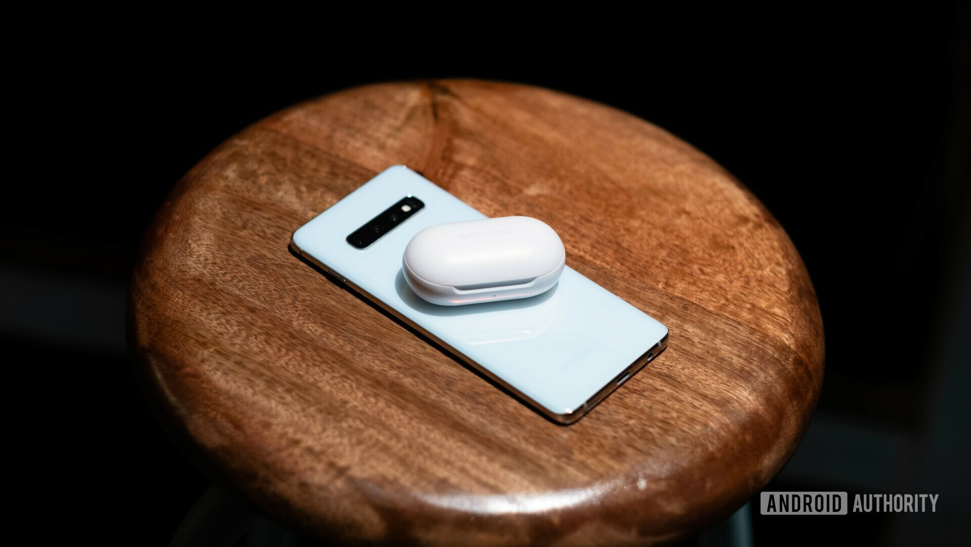 Samsung Galaxy Buds sitting on phone