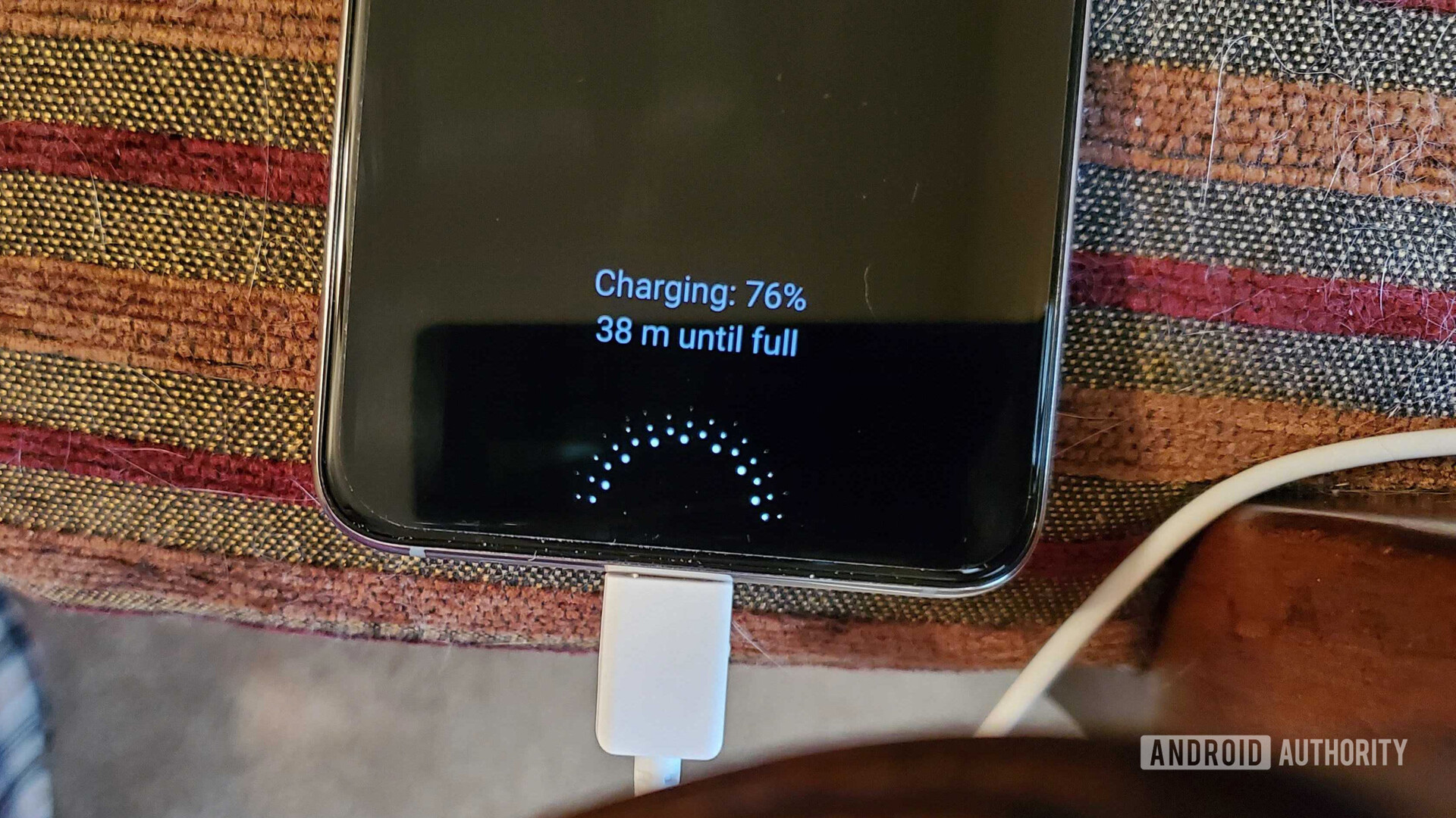 Samsung Galaxy Note 10 charging on the sofa