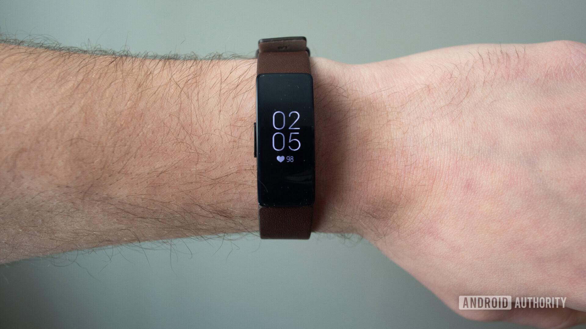 fitbit inspire hr display brown leather strap on wrist