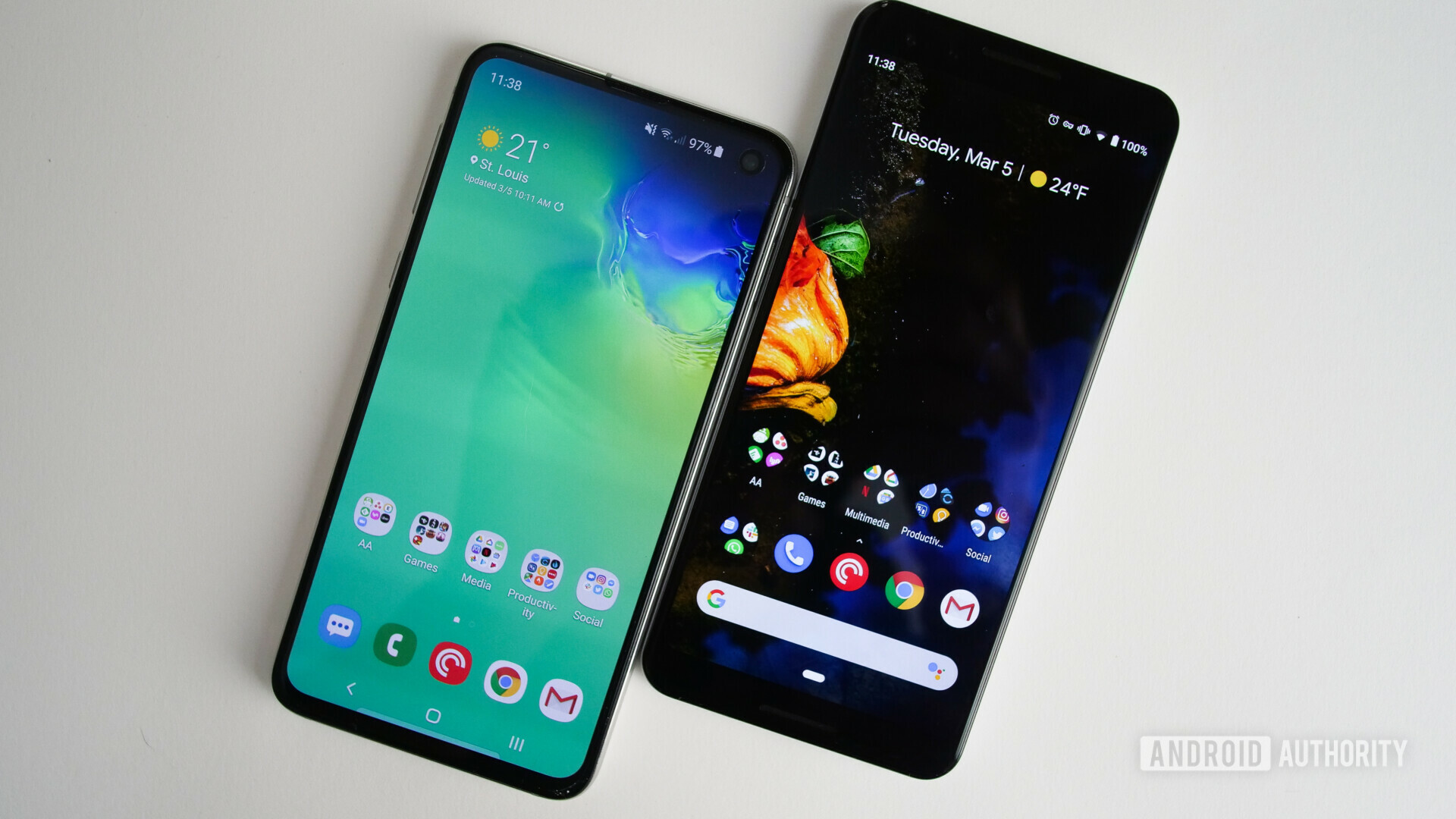 Front side of the samsung galaxy s10e next to a google pixel 3 with displays turned on running on android pie