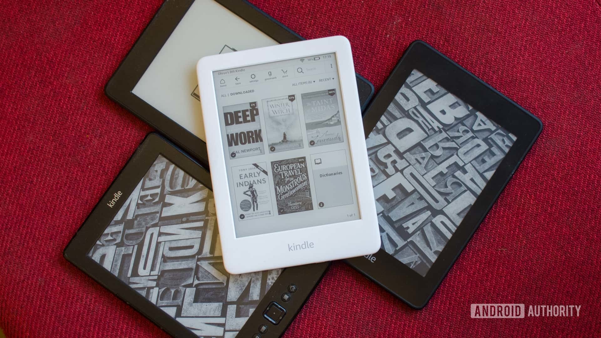 Amazon Kindle 2019 placed on top of older kindles
