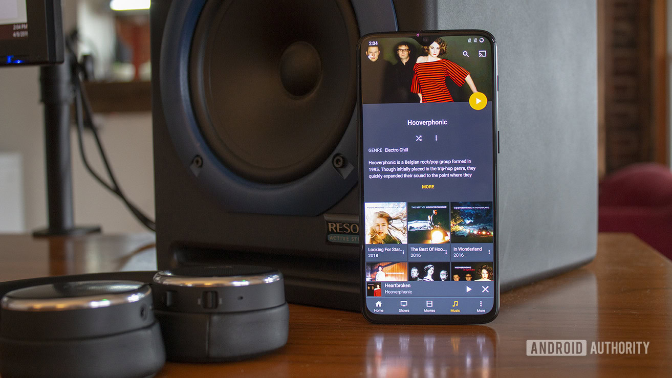 An image of a smartphone with the Plex music player on screen.