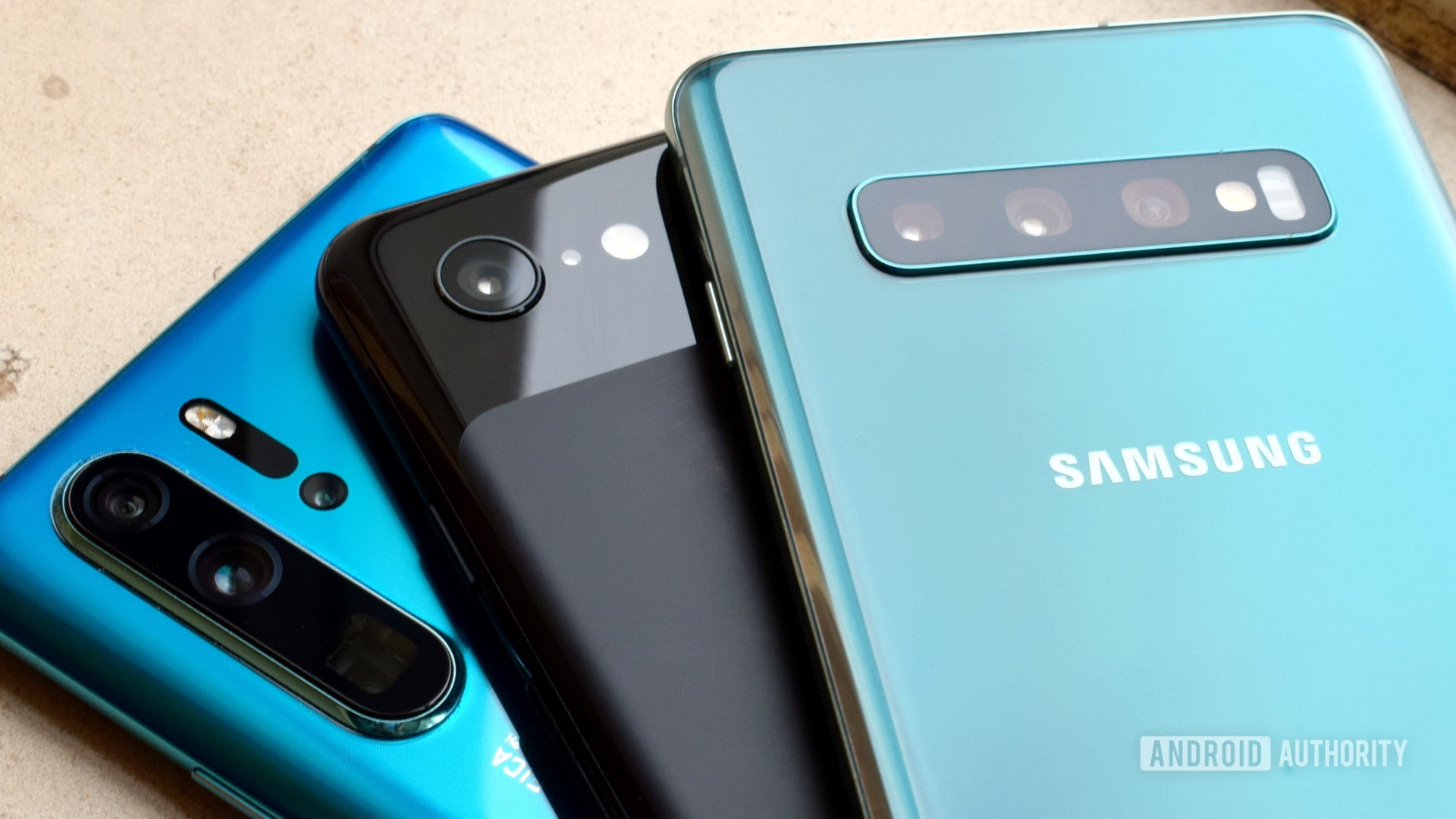Backs of the HUAWEI P30 Pro, Google Pixel 3, and Samsung Galaxy S10