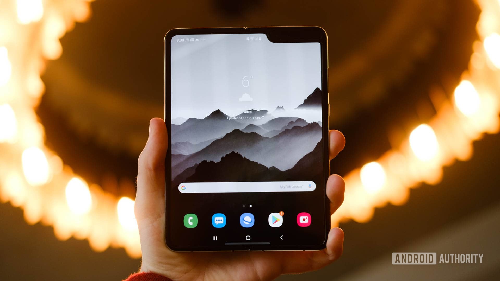 Samsung Galaxy Fold home screen in hand