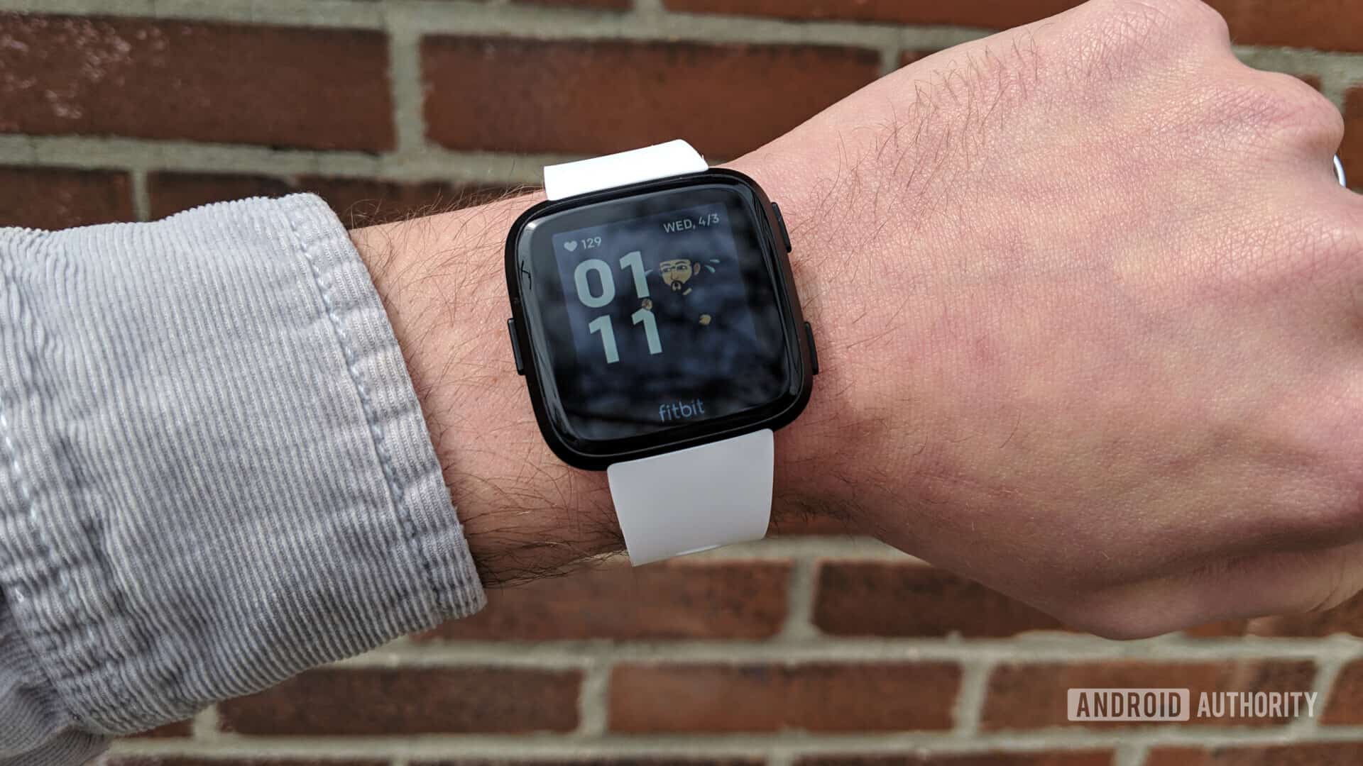 fitbit versa smartwatch with the snapchat bitmoji watch face