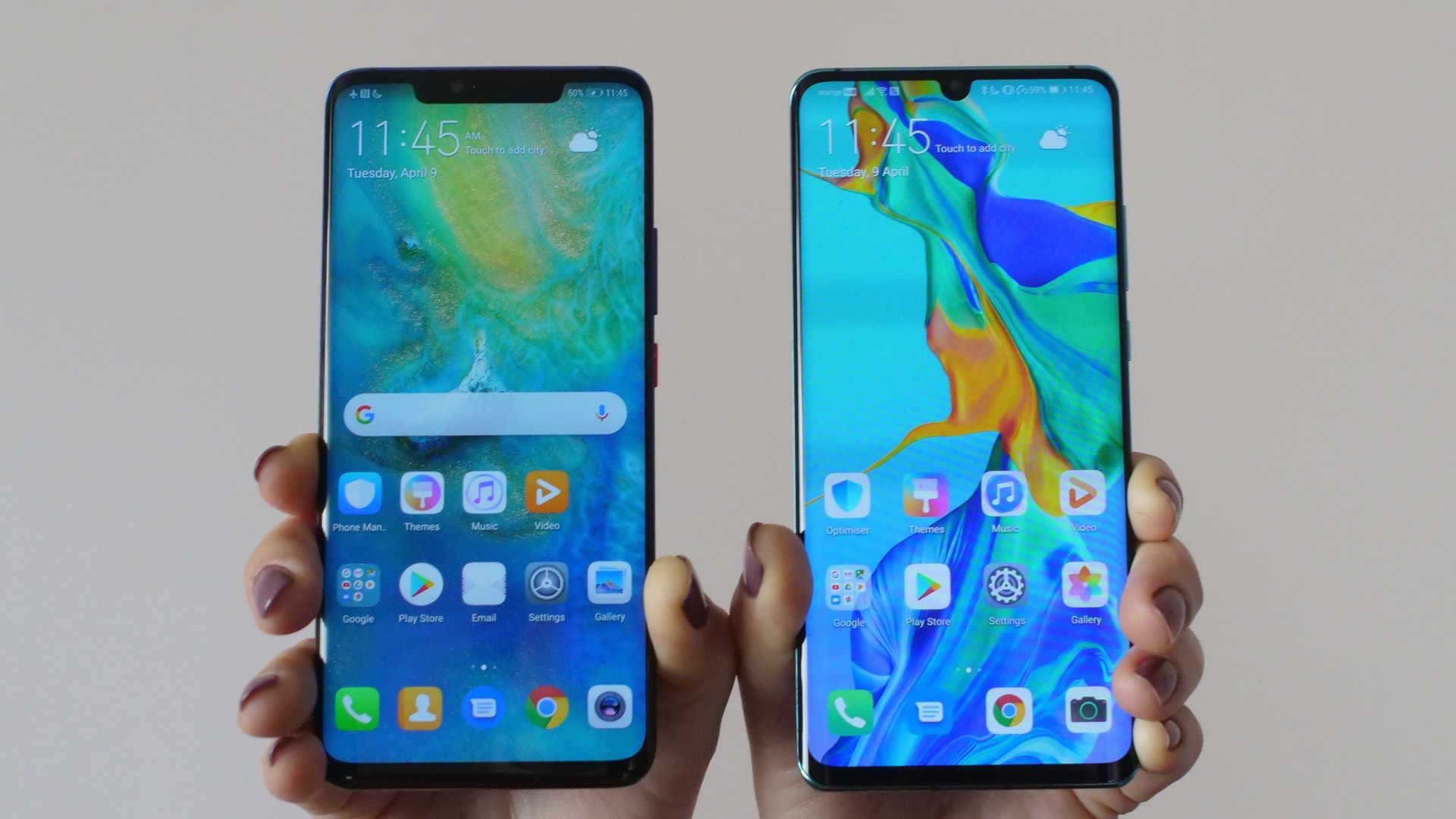 huawei p30 pro vs huawei mate 20 pro held in hand showing displays