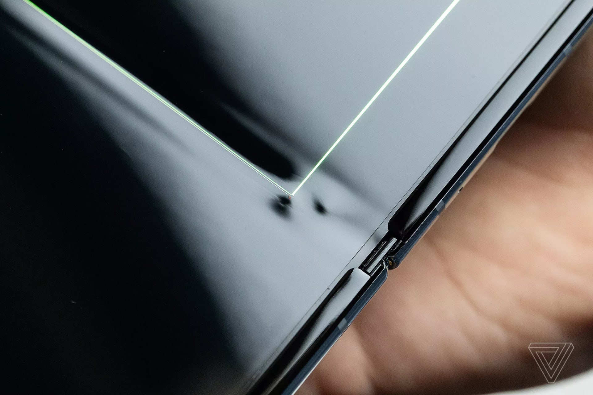 The Samsung Galaxy Fold up close and with a bump under the display.