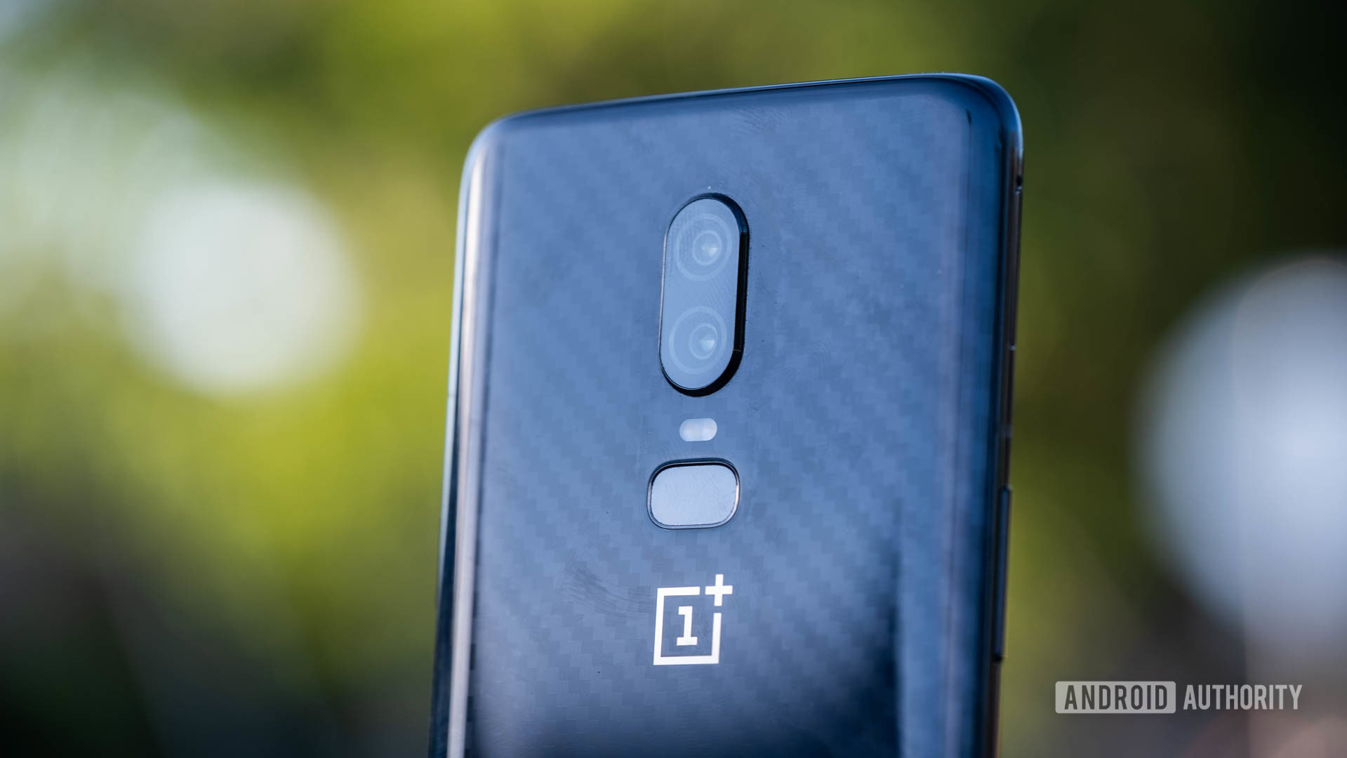 OnePlus 6 against tree