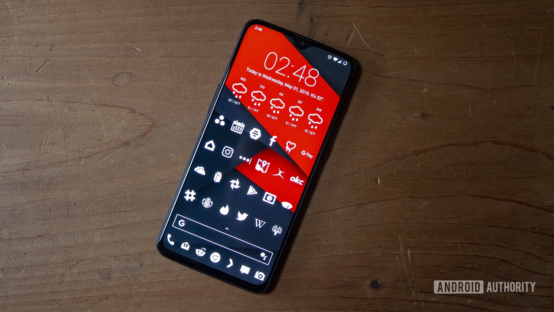 A OnePlus 6T with a customized Android home screen.