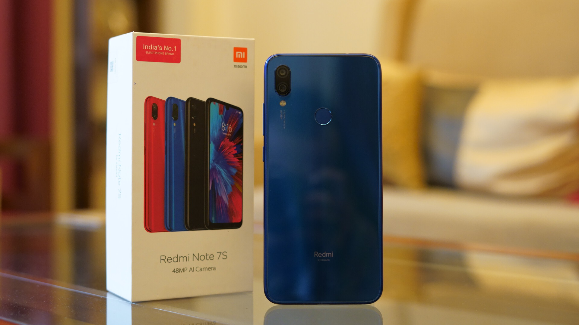 Redmi Note 7S showing back and box packaging