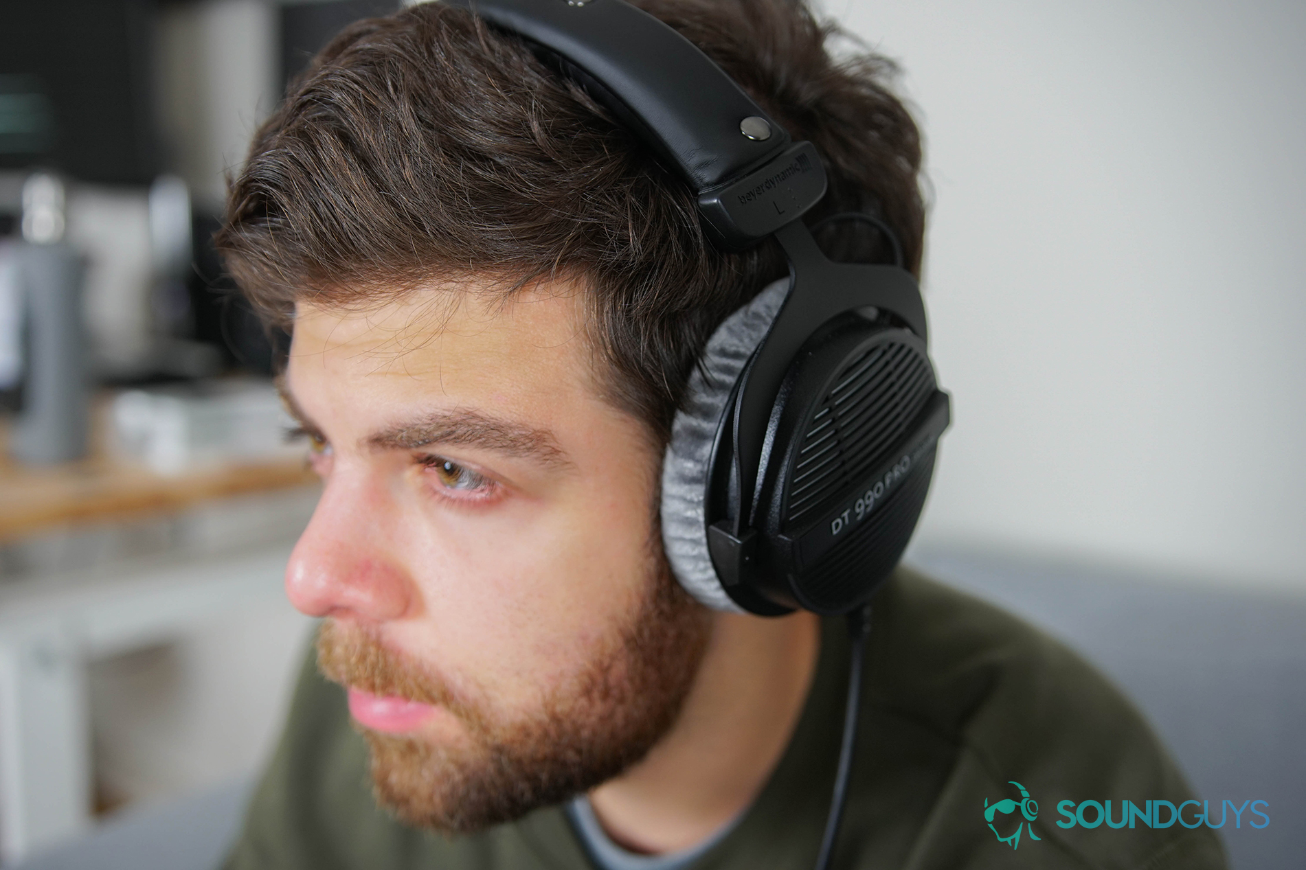 A photo of Adam Molina wearing the beyerdynamic DT 990 Pro headphones.