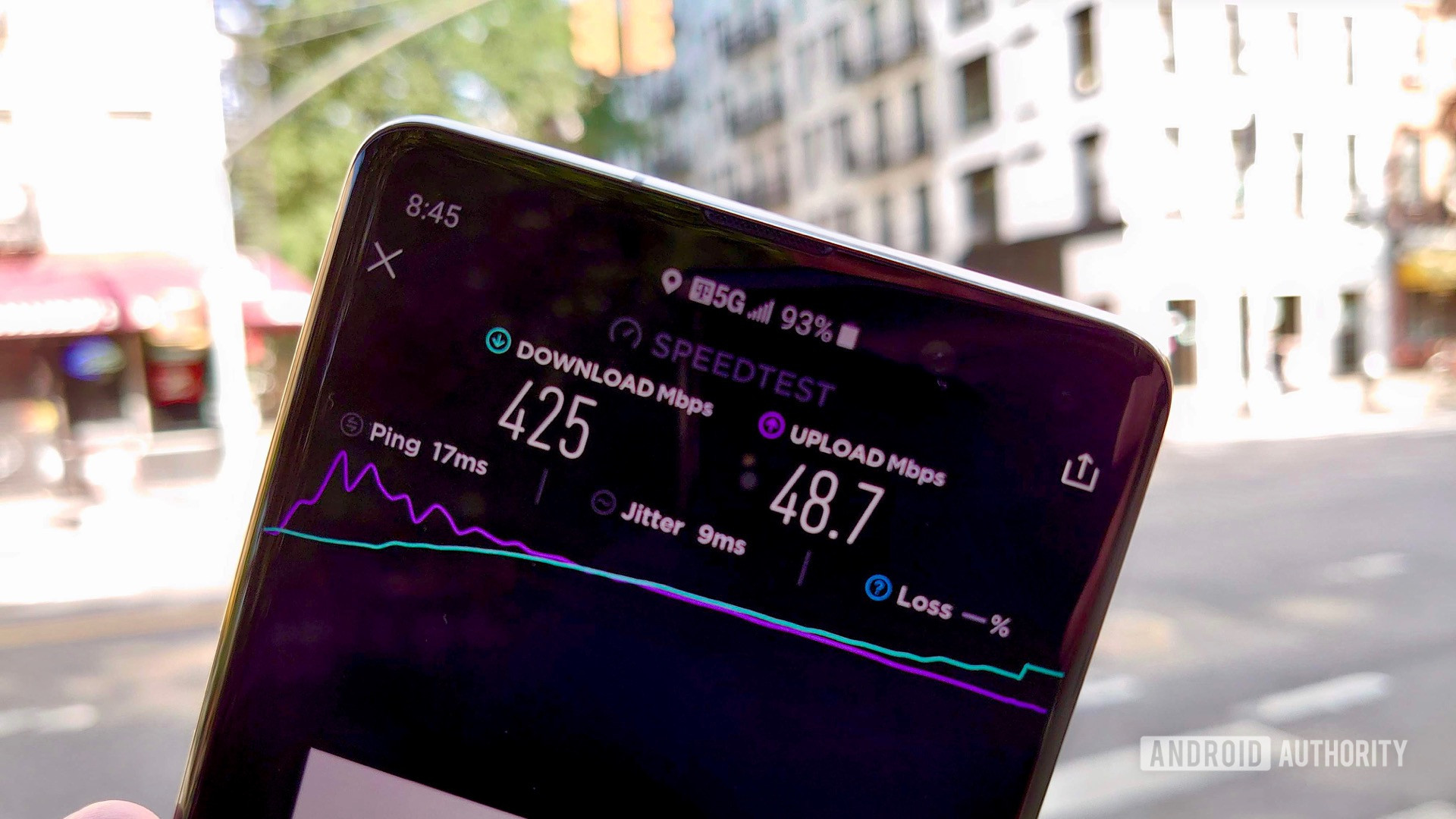 Phone in hand showing T-Mobile 5G Speed Test