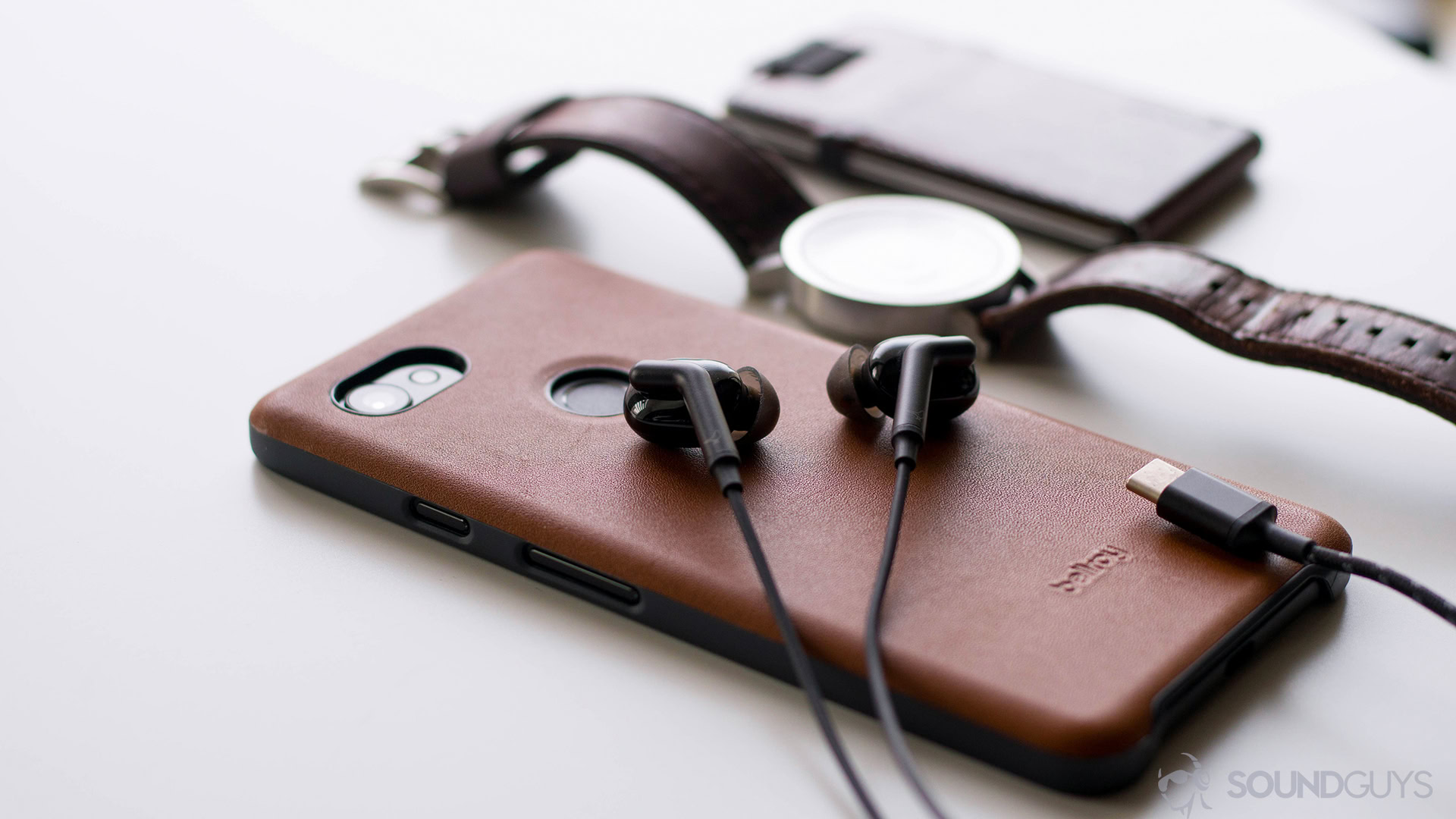 Pictured are the Libratone Q Adapt earbuds on a Pixel 2.