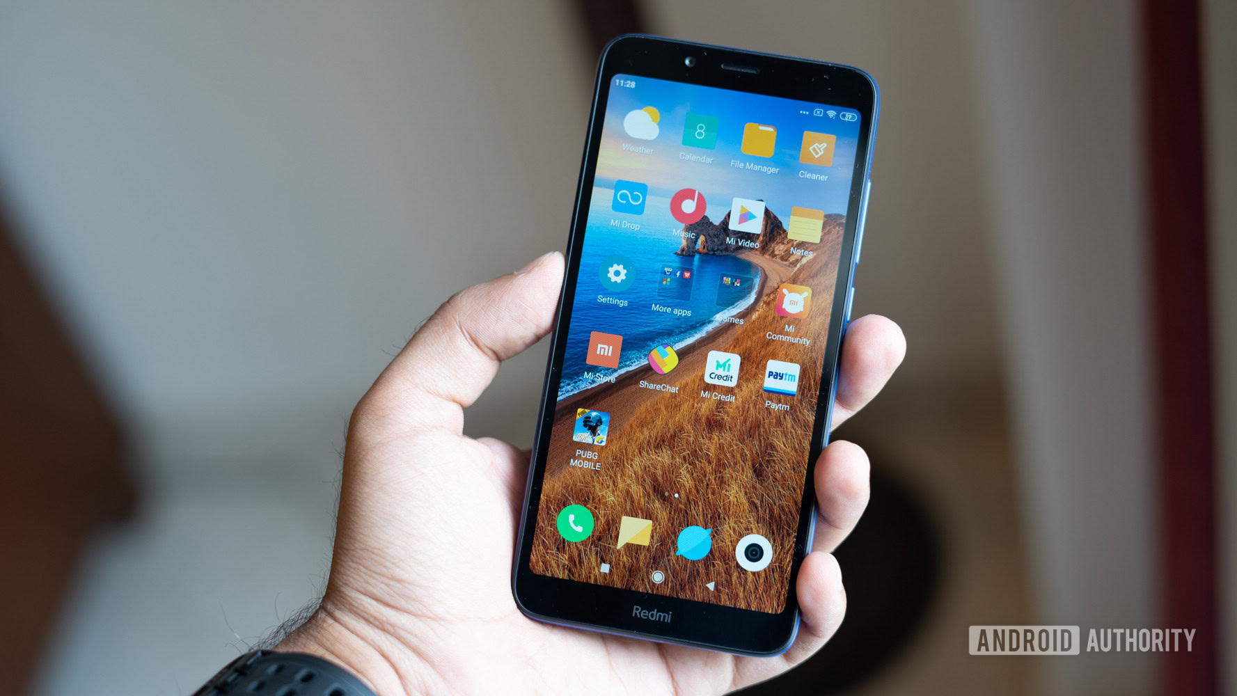 Xiaomi Redmi 7A in hand showing display