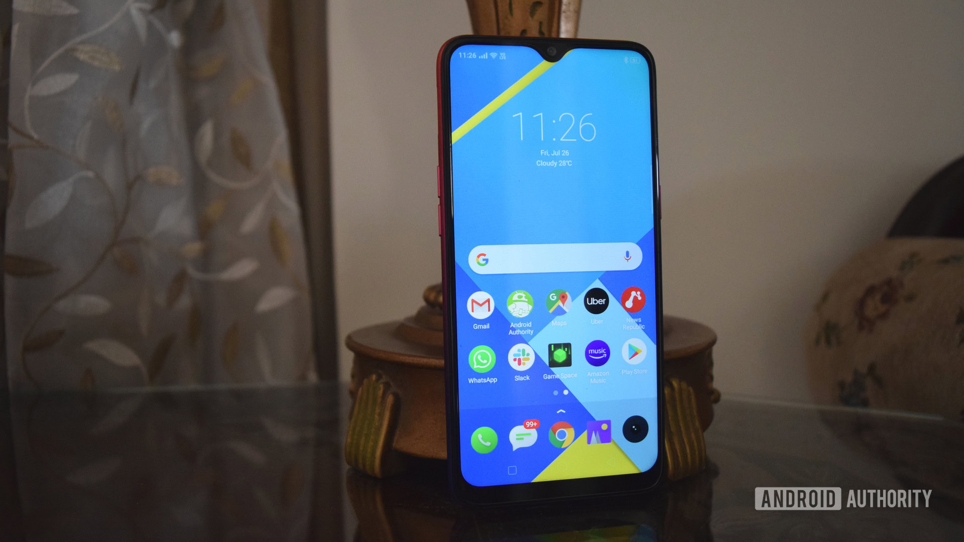 realme 3i front standing on table