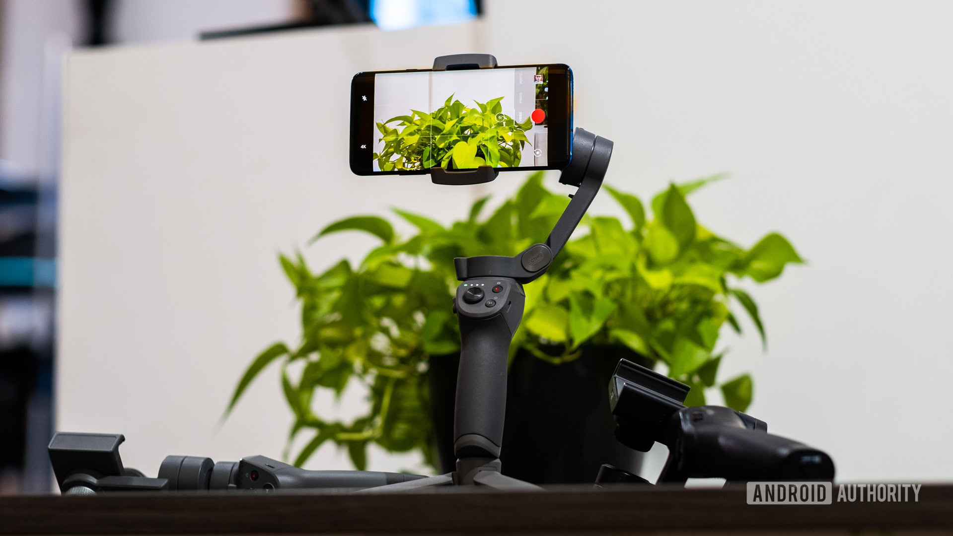 DJI Osmo Mobile 3 standing on table vs old Osmo Mobiles