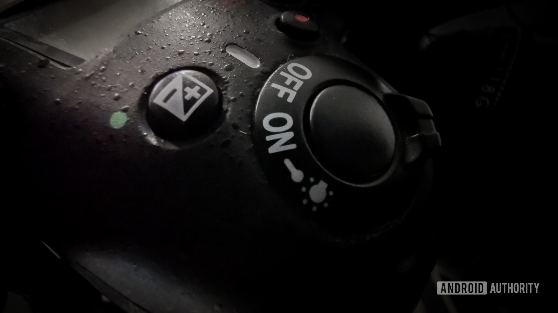 DSLR shutter button, power toggle, and EV button.