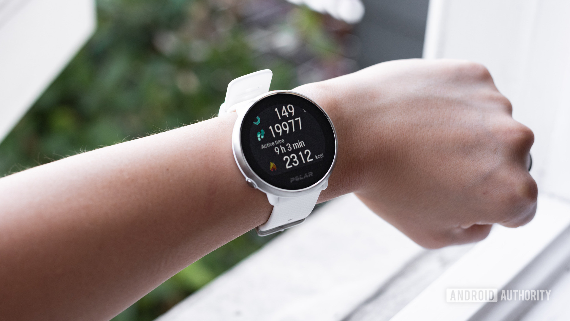 Polar Ignite smart fitness watch being worn on a female's left wrist.
