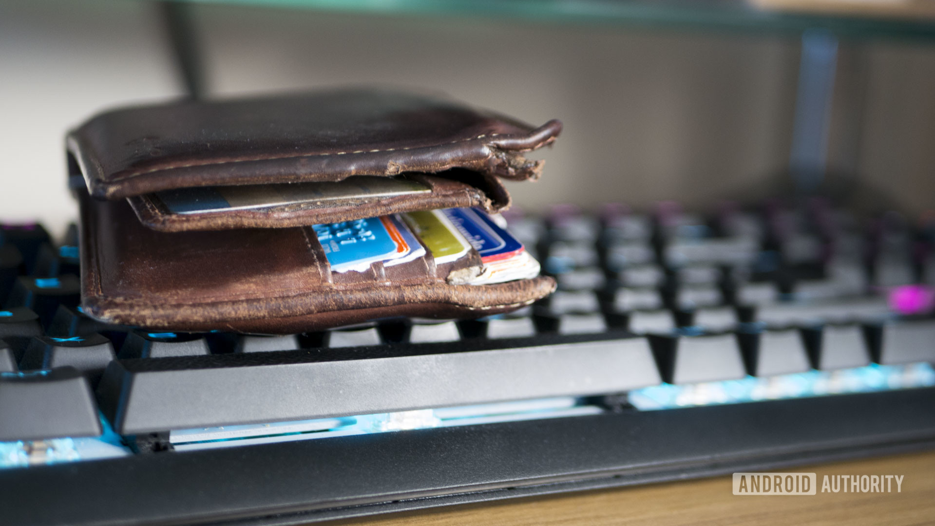  Wallet with credit cards on a keyboard - subscription services cost