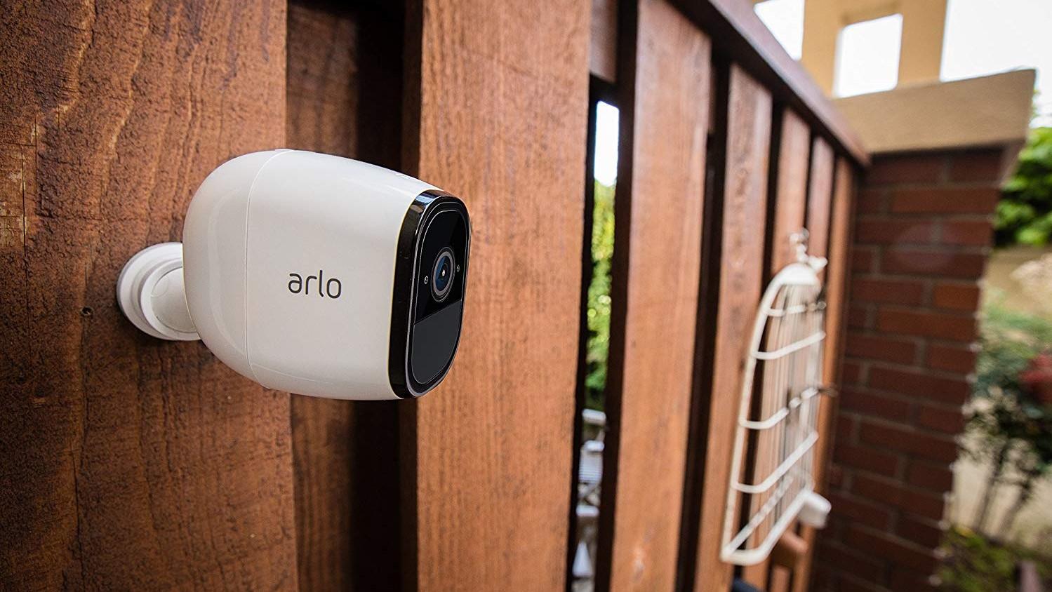 The Arlo Pro security camera attached to a wall.