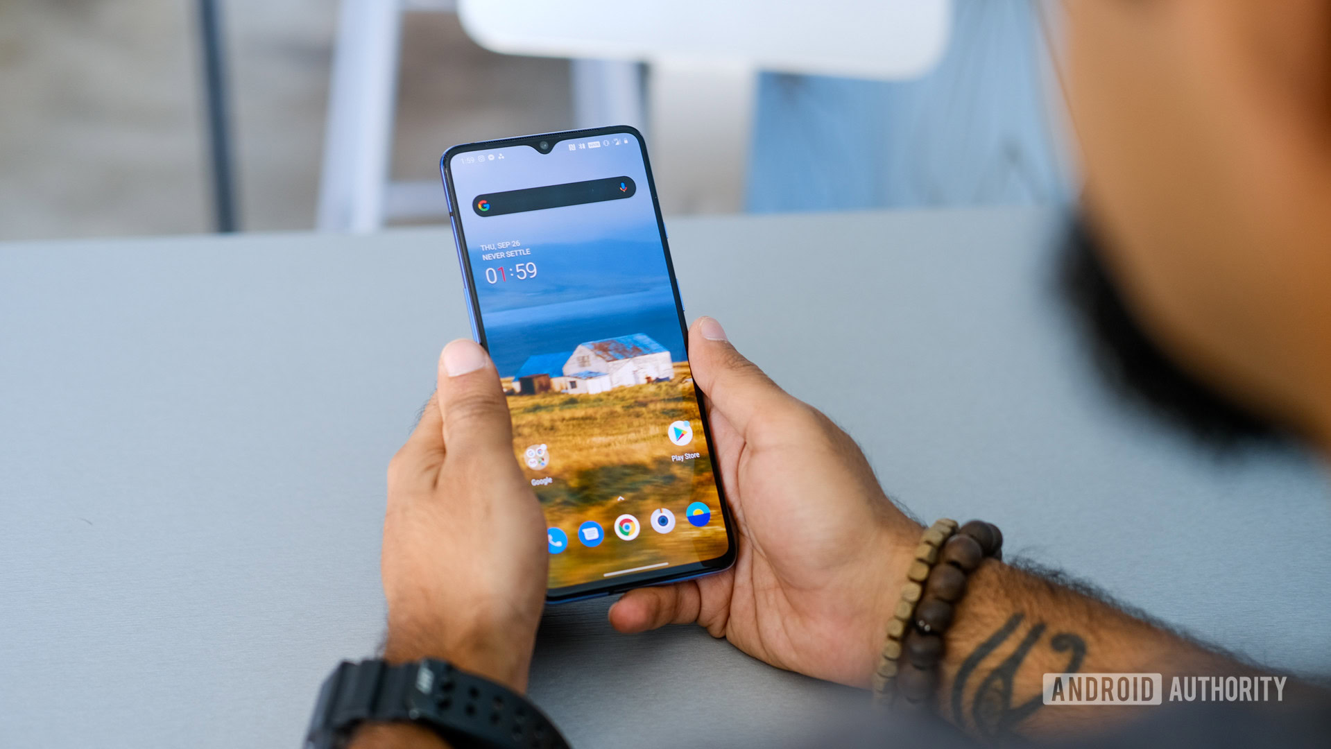 OnePlus 7T using in hand on table 2