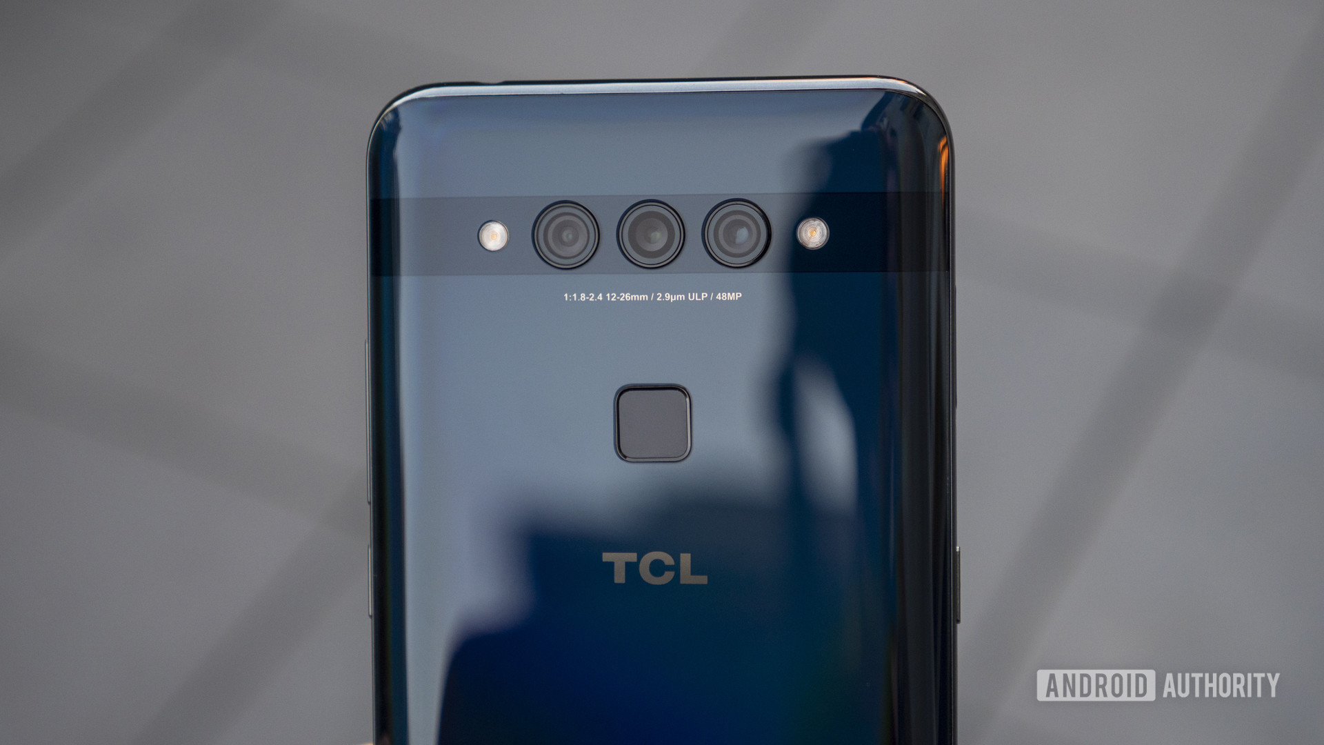 TCL Plex hands on blue in hand rear cameras 1