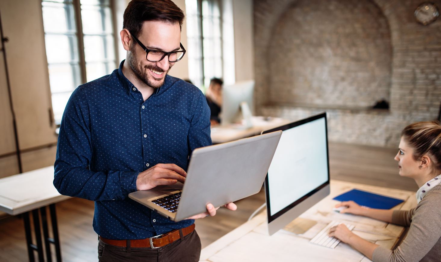 Young Professional Businessman Holding Laptop