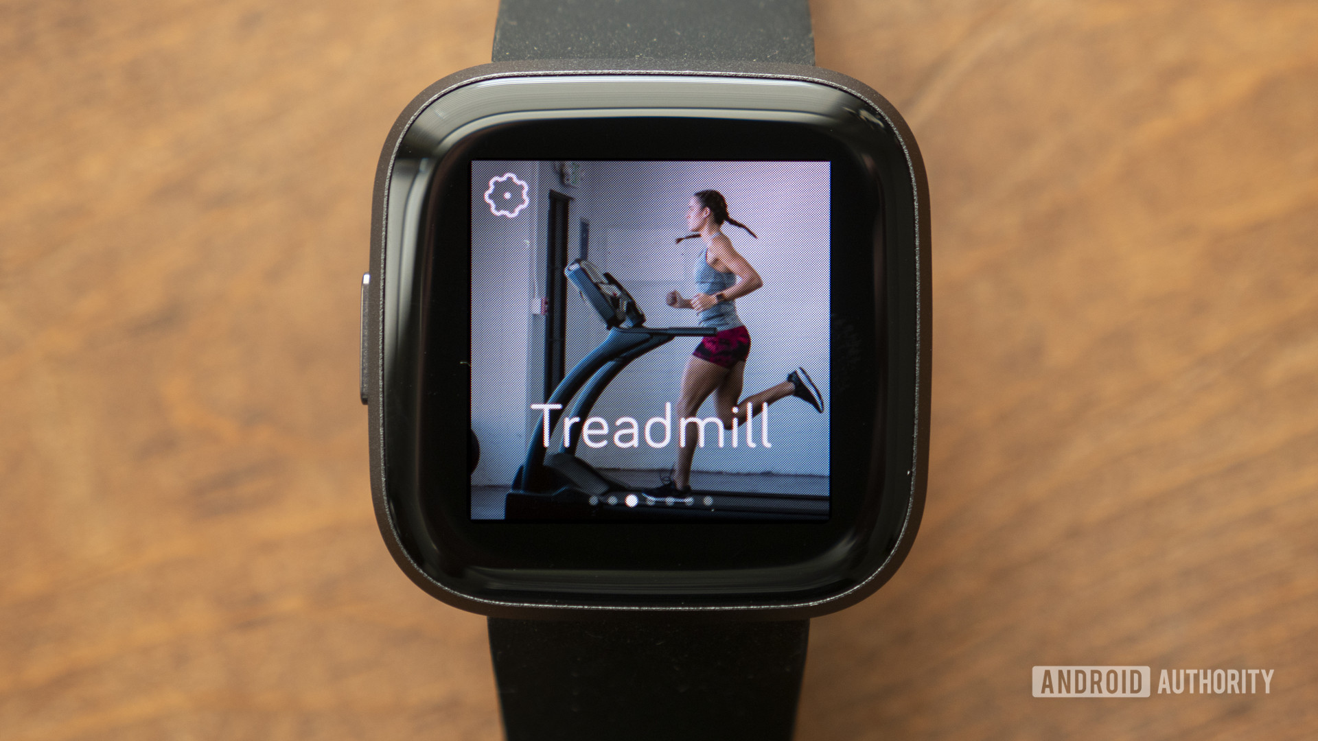 A Versa 2 displays a treadmill workout on its bright AMOLED display.