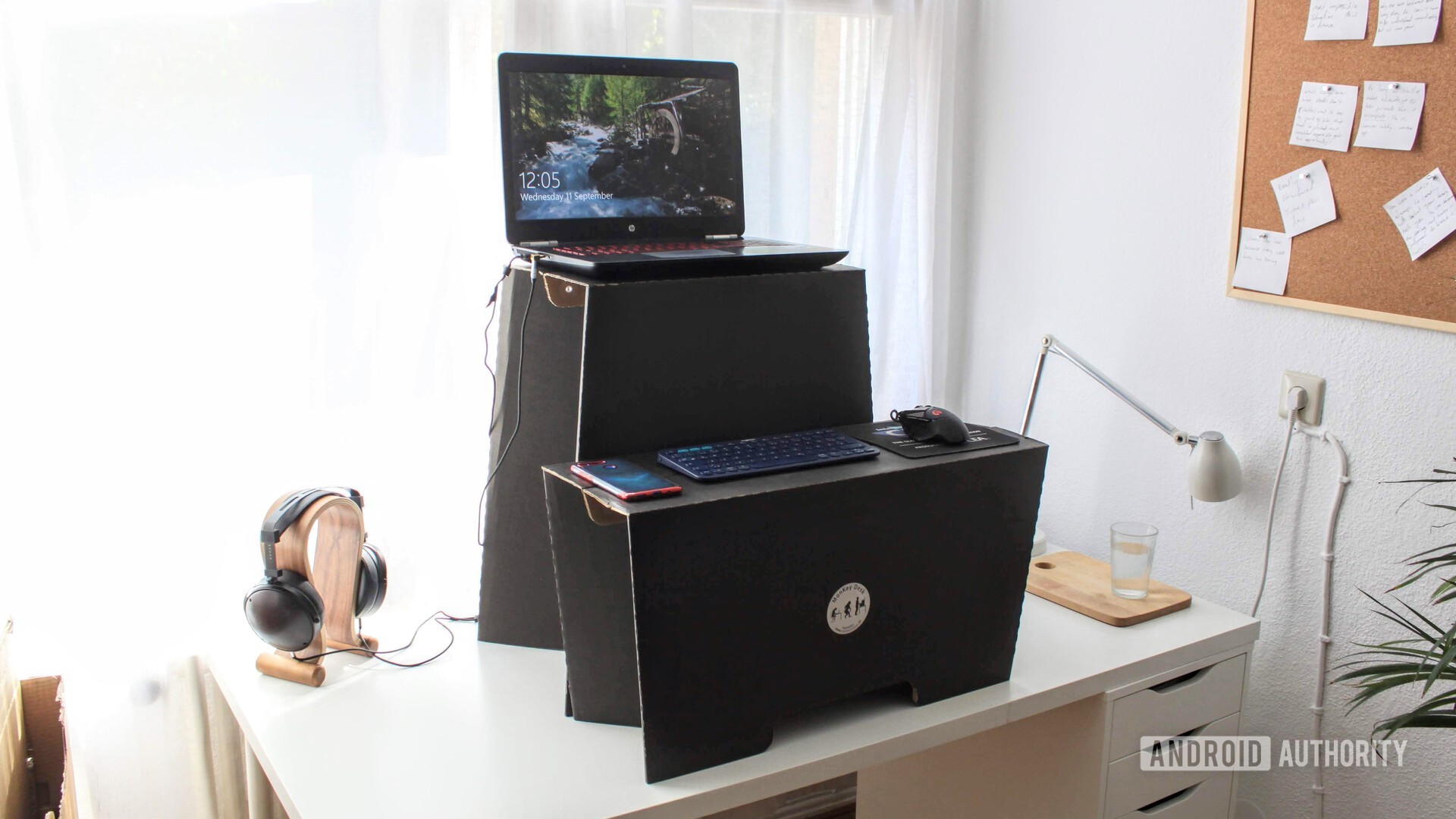 A monkey desk by room in a box cardboard standing desk on top of a white desk
