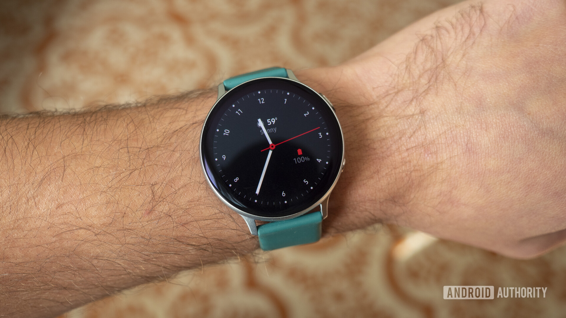 A user models a Samsung Galaxy Watch Active 2 watch face on his wrist.