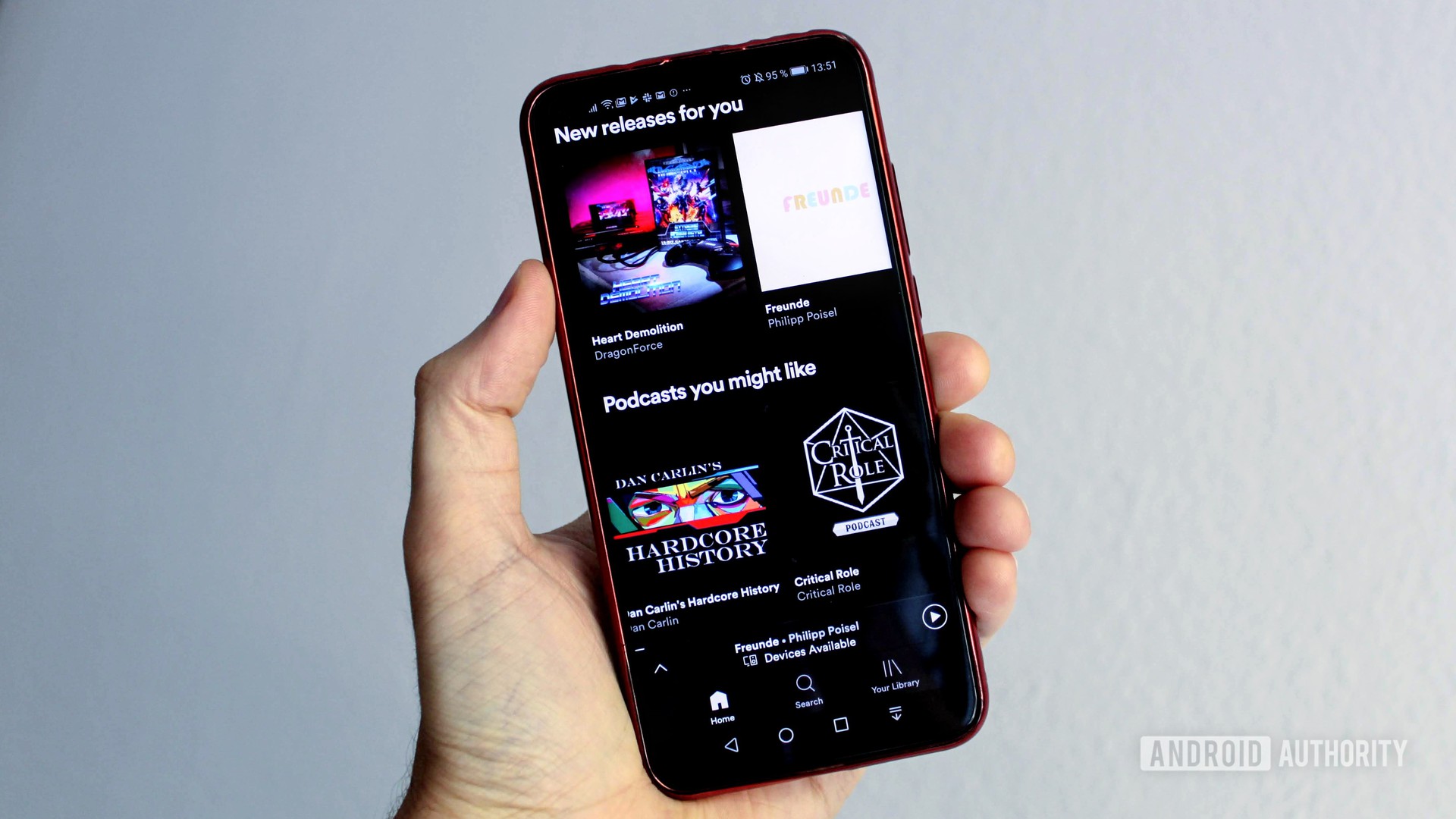 Spotify menu on a smartphone in a person's hand. How to setup up Spotify parental controls. 