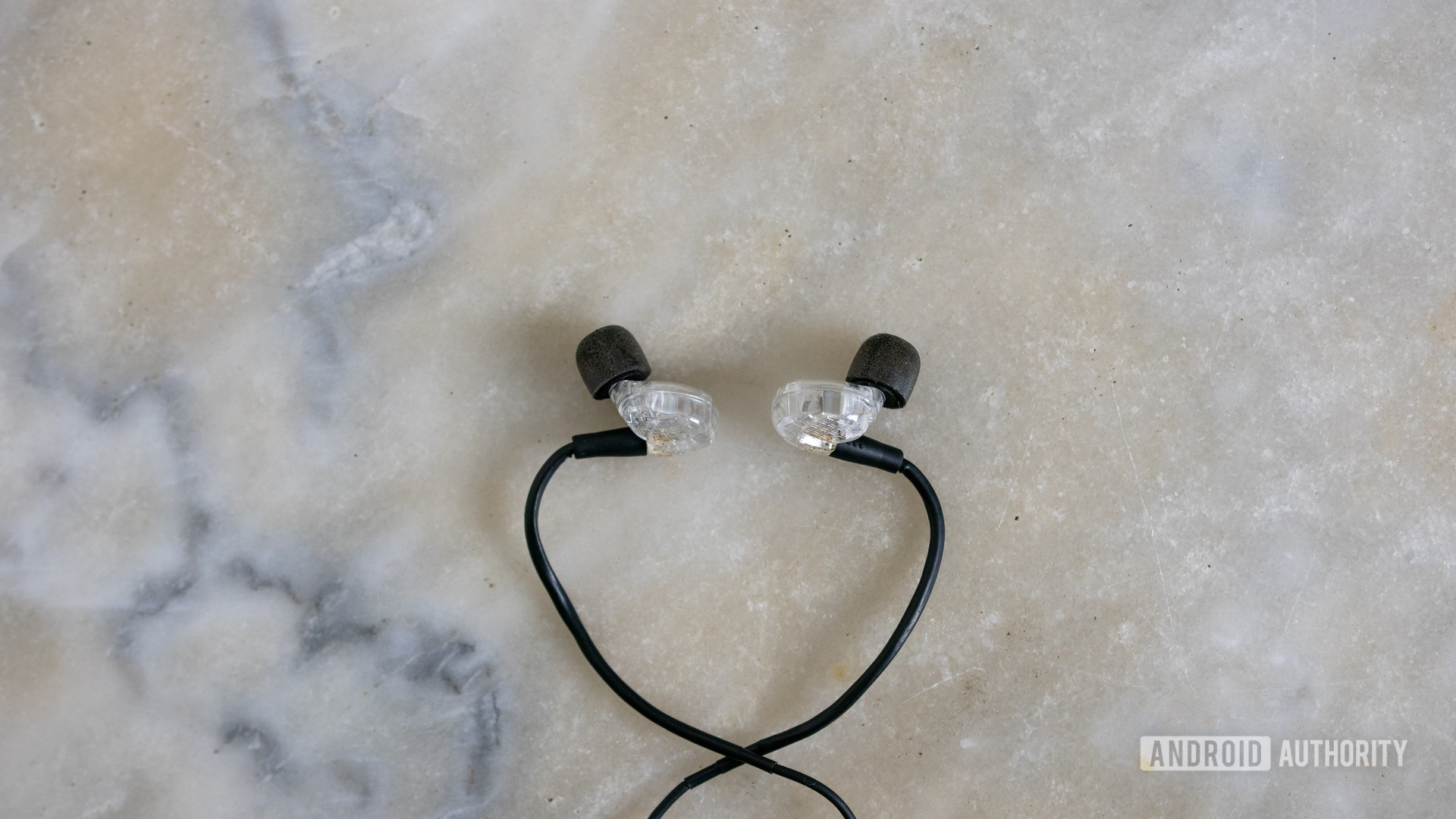 ADV.Sound Model 3 in ears with memory foam ear tips on marble table