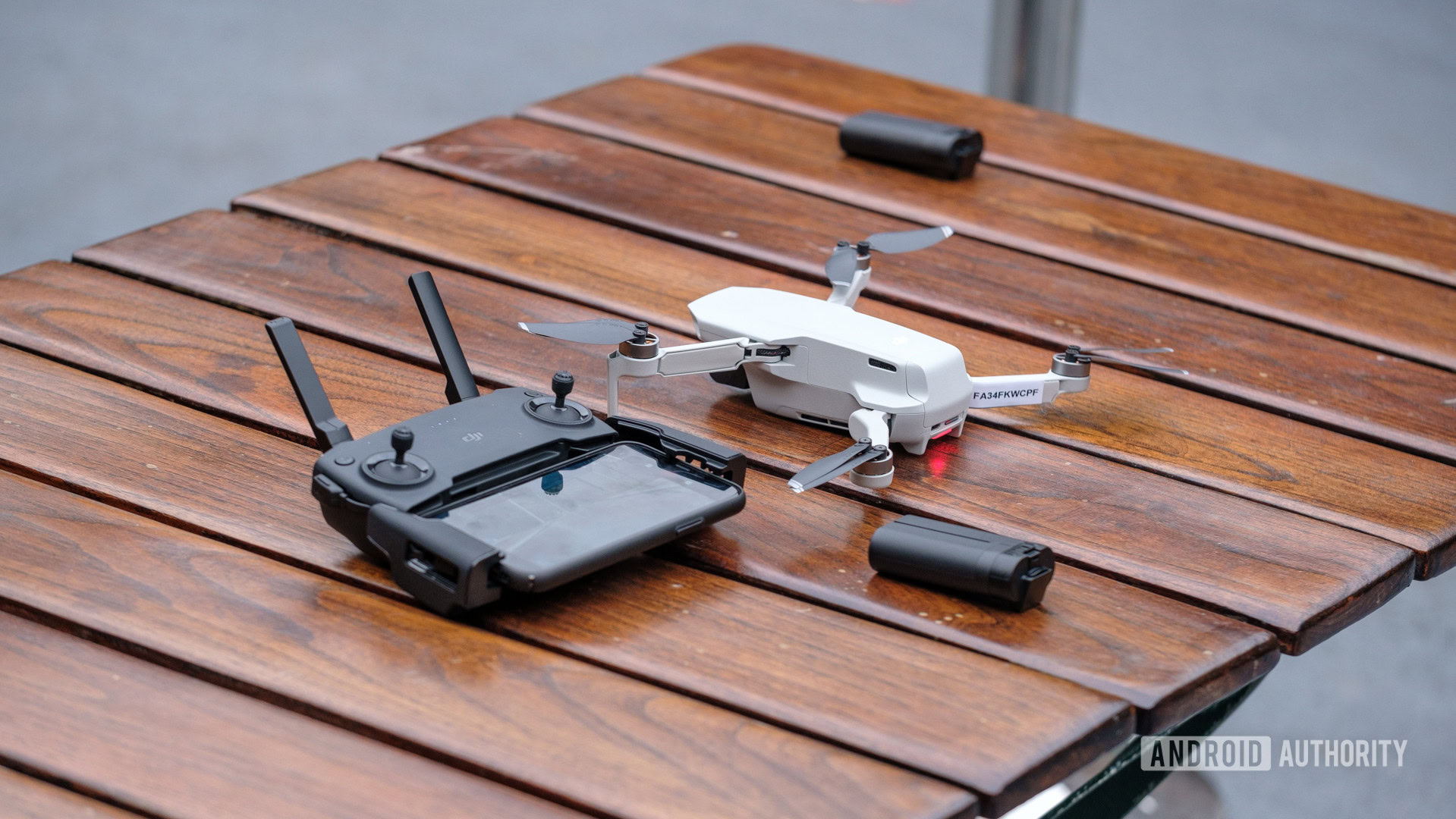 DJI Mavic Mini on table next to controller