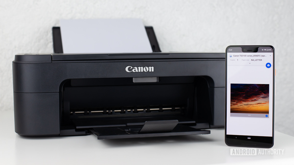 Google Cloud print on smartphone next to Canon printer