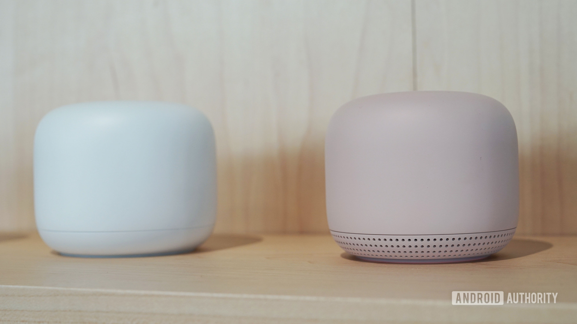 Google Nest Wi Fi in white and pink