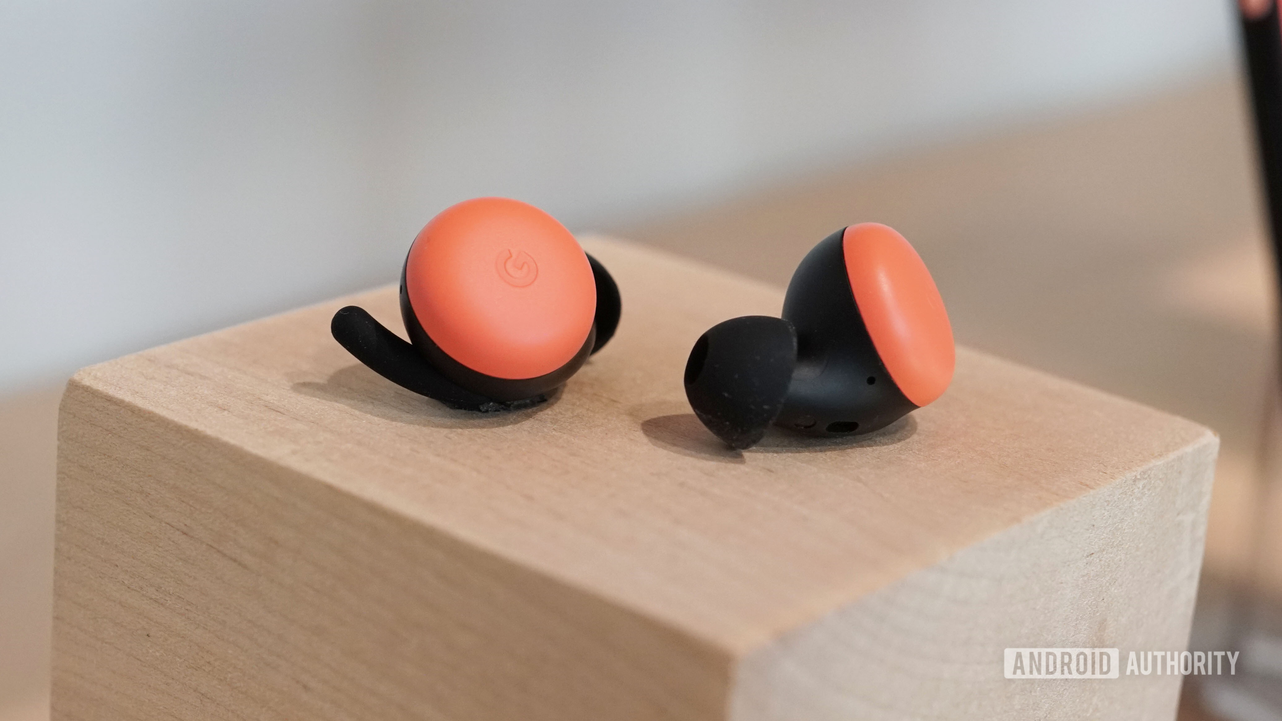Google Pixel Buds 2 in Oh So Orange on a cube at the Made By Google event.